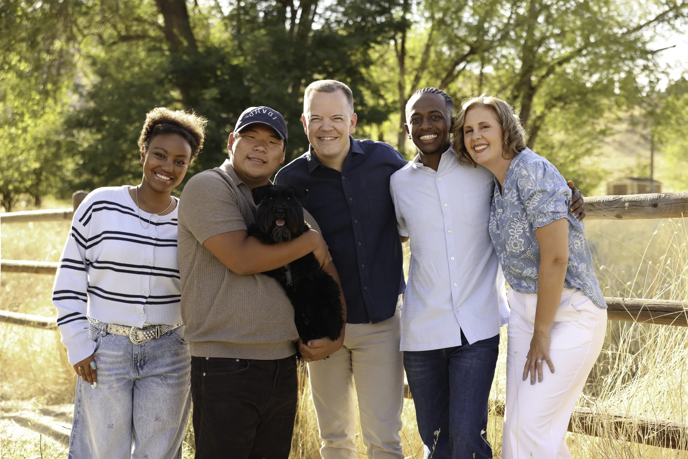Aaron and Cacey Klein with their three children and family dog outdoors in Idaho.